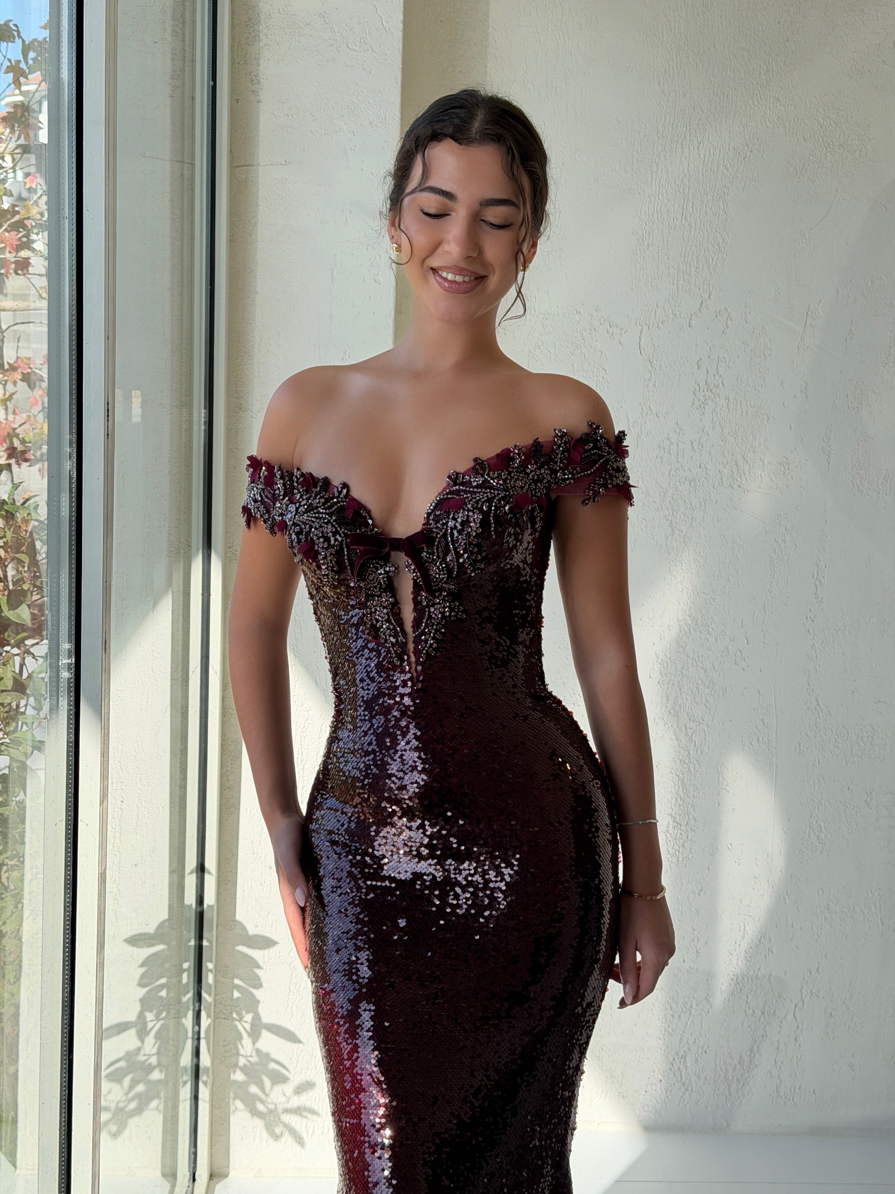 Draped in burgundy.