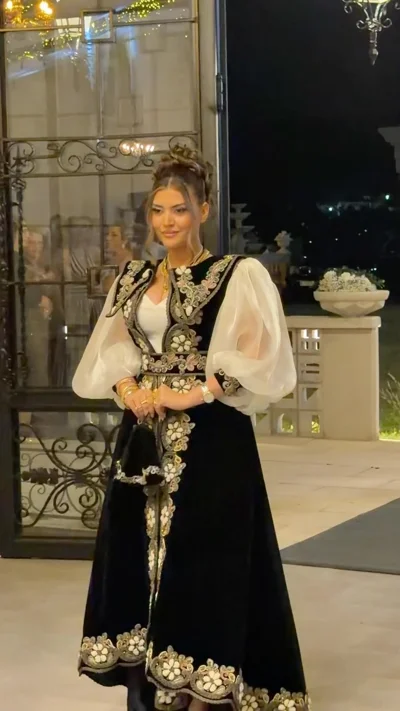 Veshje tradicionale e zezë për kanagjegj