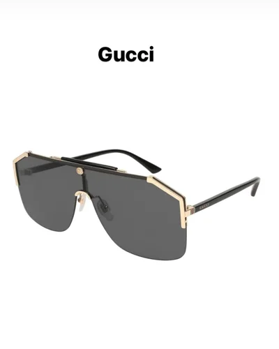 Syze dielli Gucci maskë me kornizë ari